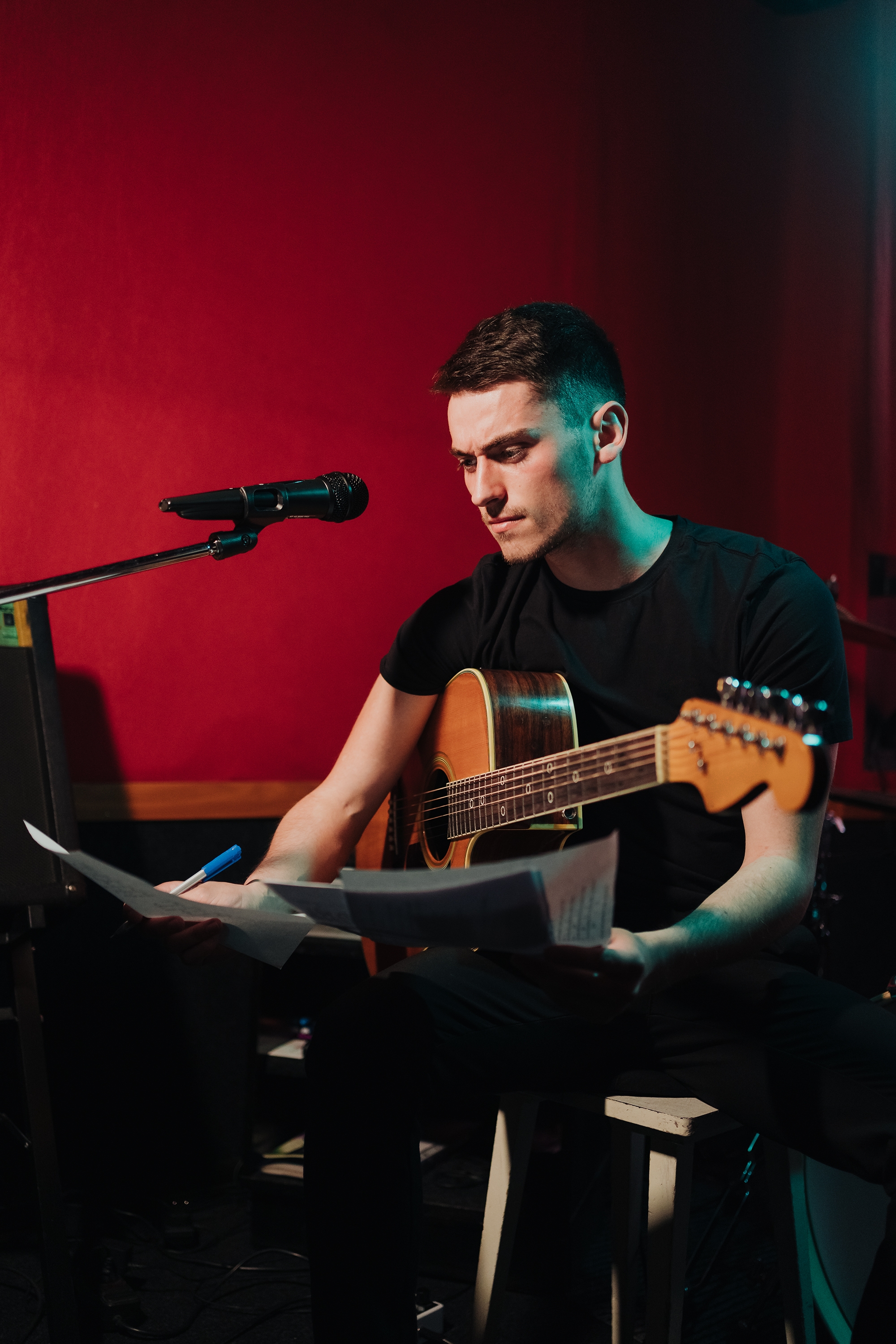 man writing song in an authentic studio with an ac 2022 11 15 09 48 42 utc